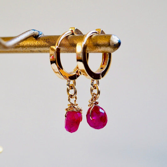 ruby × small gold hooped pierce