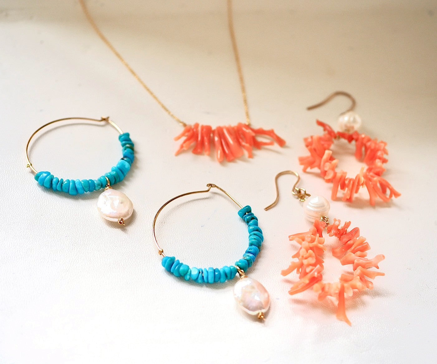 pearl × circled coral pierce