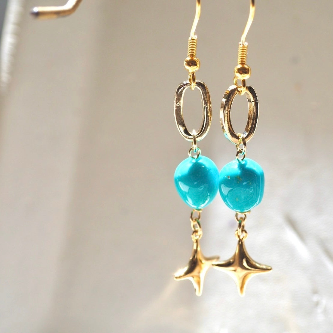 turquoise × gold motif pierce